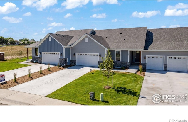 view of front facade with a garage and a front lawn