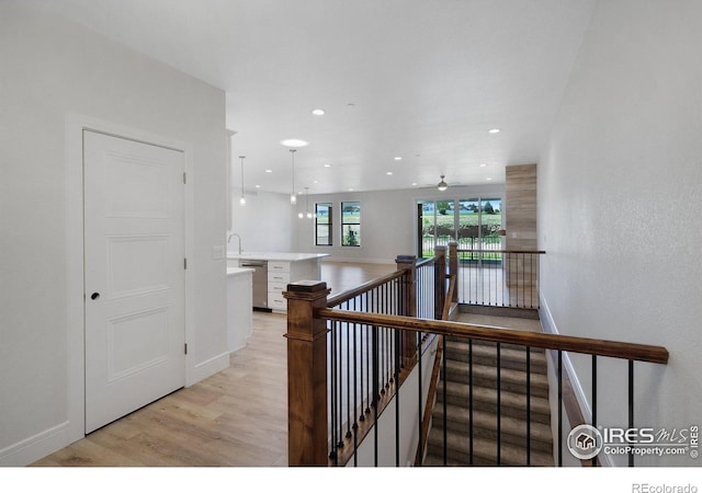 corridor featuring light hardwood / wood-style floors