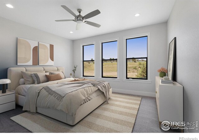 bedroom with ceiling fan and carpet flooring