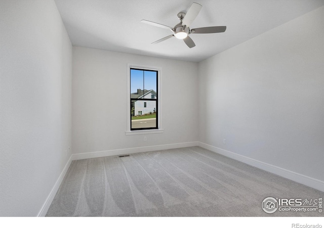 unfurnished room with carpet floors and ceiling fan