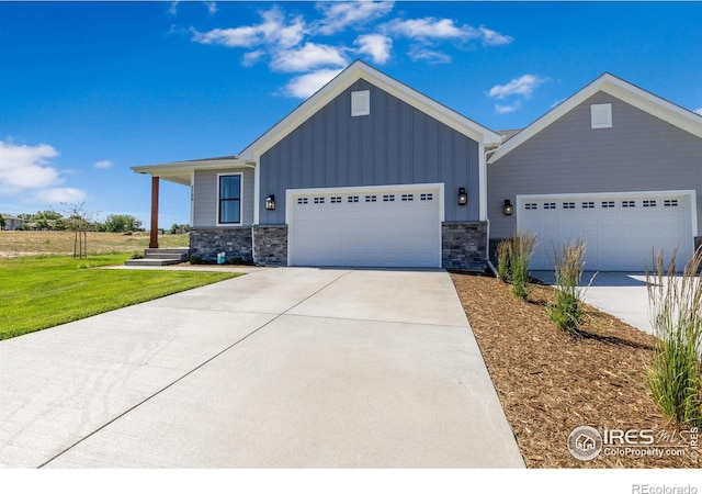 view of front of house featuring a garage and a front lawn