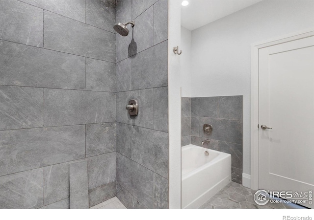 bathroom featuring shower with separate bathtub and tile patterned floors