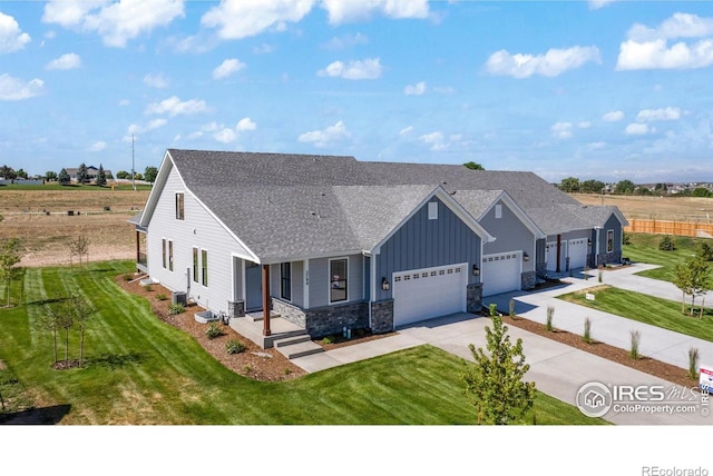 view of front of home featuring a front lawn and a garage