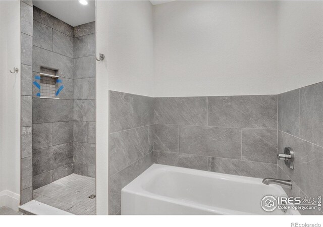 5700 2nd Street Rd, Greeley, CO 80634 - bathroom with a bath and tiled shower