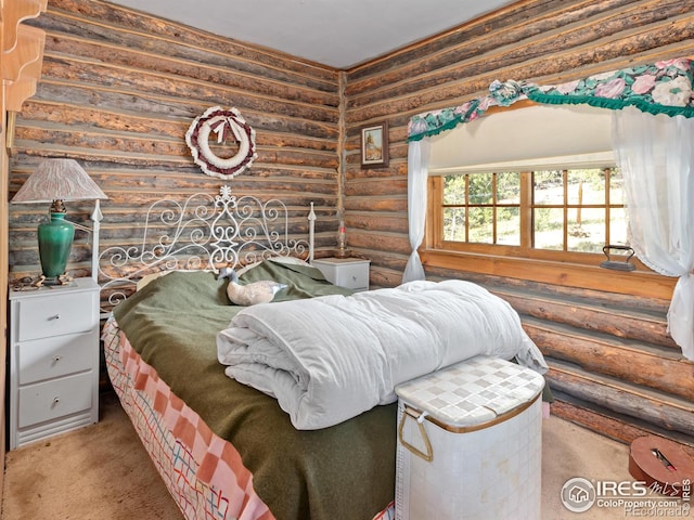 carpeted bedroom with log walls