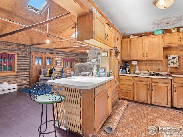 kitchen featuring a skylight, rustic walls, wood ceiling, sink, and light hardwood / wood-style floors