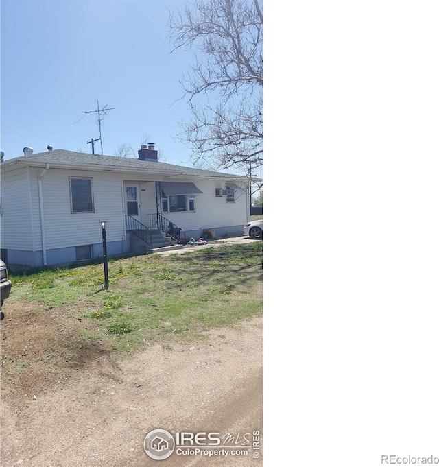 1550 E 18th St, Greeley, CO 80631 - view of front of home with a chimney