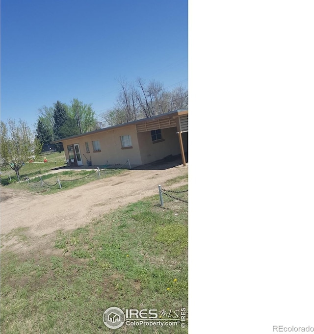 1550 E 18th St, Greeley, CO 80631 - view of front of home with driveway and an attached carport