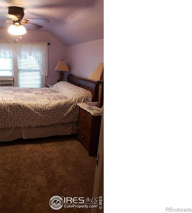 carpeted bedroom featuring vaulted ceiling and ceiling fan