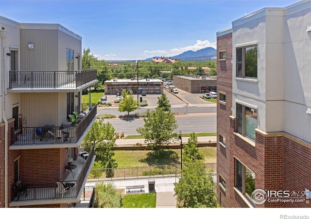 property's view of city with a mountain view