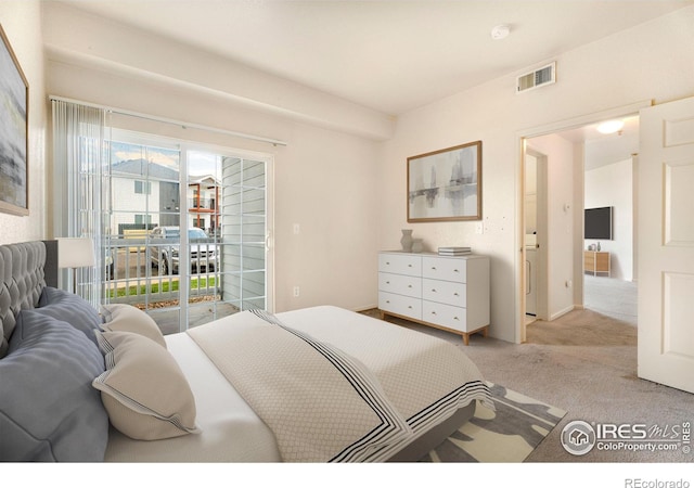 bedroom featuring light carpet, multiple windows, and access to outside