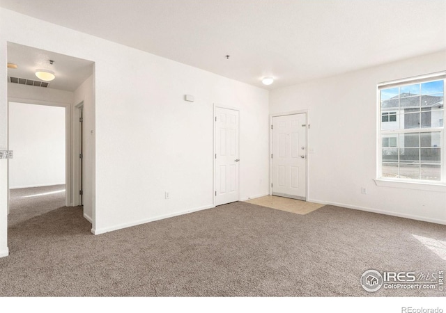 2990 W C St Unit 103, Greeley, CO 80631 - carpeted spare room featuring baseboards