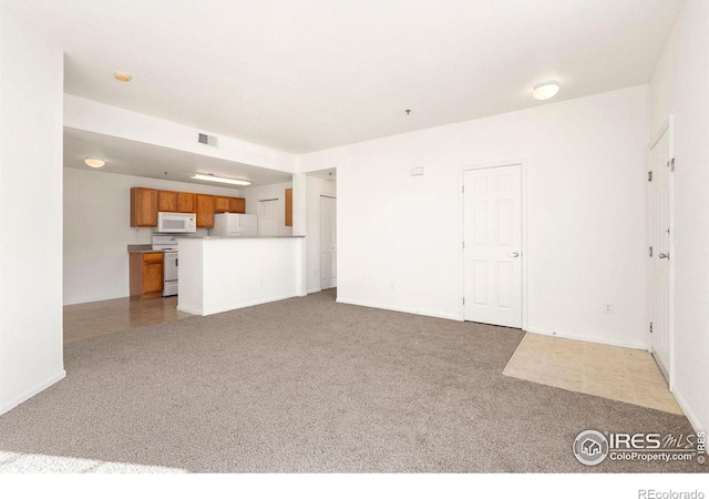 unfurnished living room featuring tile patterned floors