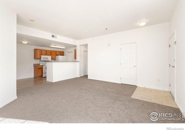 2990 W C St Unit 103, Greeley, CO 80631 - unfurnished living room with carpet flooring and baseboards