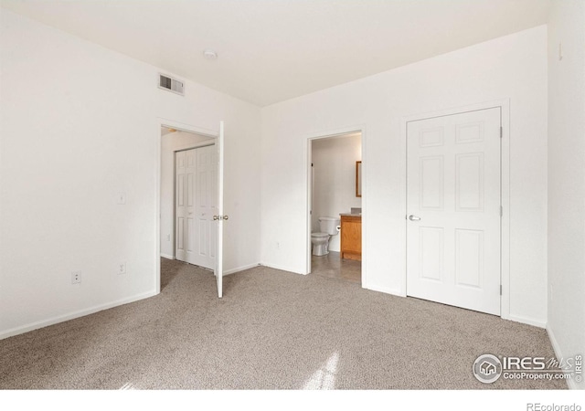 2990 W C St Unit 103, Greeley, CO 80631 - unfurnished bedroom with carpet flooring, baseboards, and connected bathroom