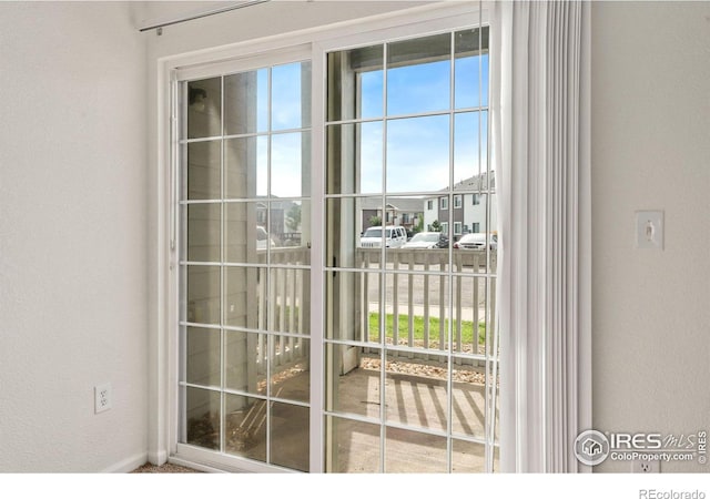 2990 W C St Unit 103, Greeley, CO 80631 - doorway with a textured wall and baseboards