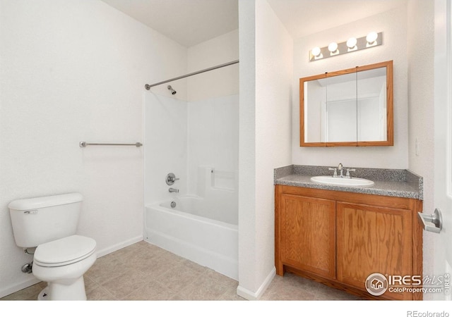 2990 W C St Unit 103, Greeley, CO 80631 - full bath featuring toilet, vanity, washtub / shower combination, and baseboards
