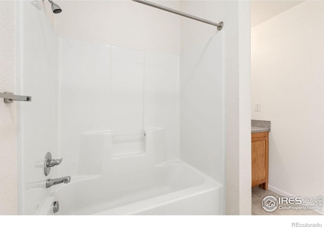 2990 W C St Unit 103, Greeley, CO 80631 - bathroom featuring bathtub / shower combination, vanity, and tile patterned floors