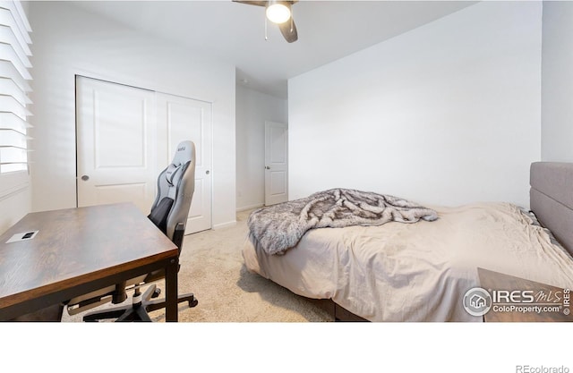 bedroom featuring ceiling fan, a closet, and light carpet