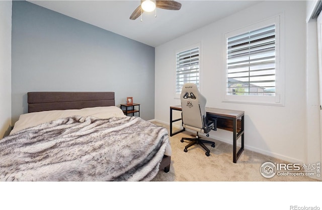 carpeted bedroom with ceiling fan