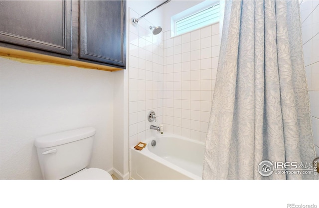 bathroom featuring toilet and shower / tub combo with curtain