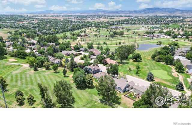 drone / aerial view with a water and mountain view