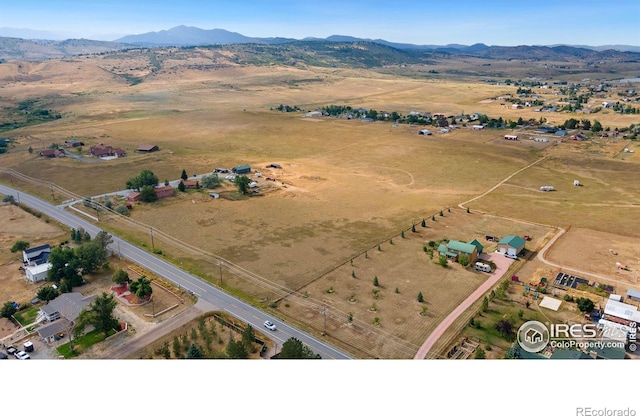 bird's eye view with a rural view and a mountain view