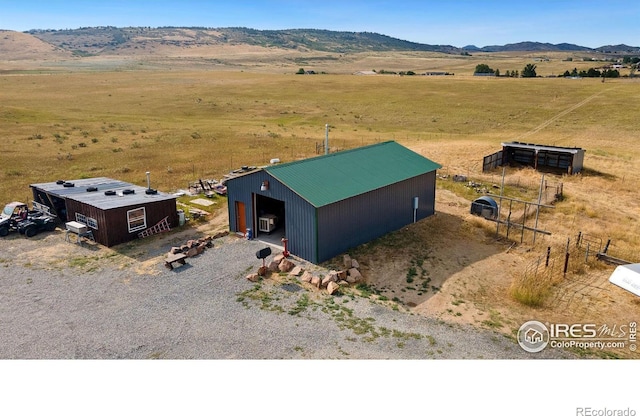 birds eye view of property featuring a rural view and a mountain view