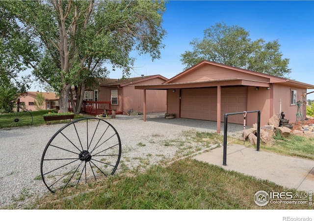 ranch-style house featuring a garage