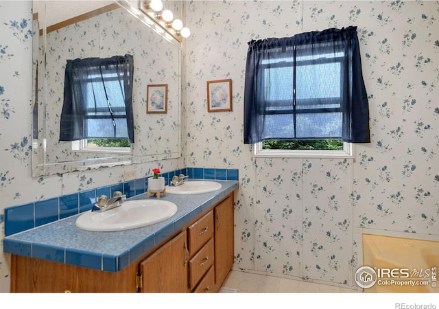 bathroom with vanity and tile patterned flooring