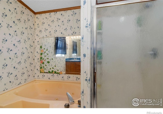 bathroom featuring vanity, a textured ceiling, independent shower and bath, and crown molding