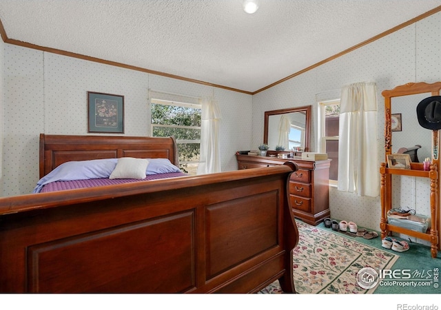 bedroom featuring a textured ceiling, vaulted ceiling, and crown molding