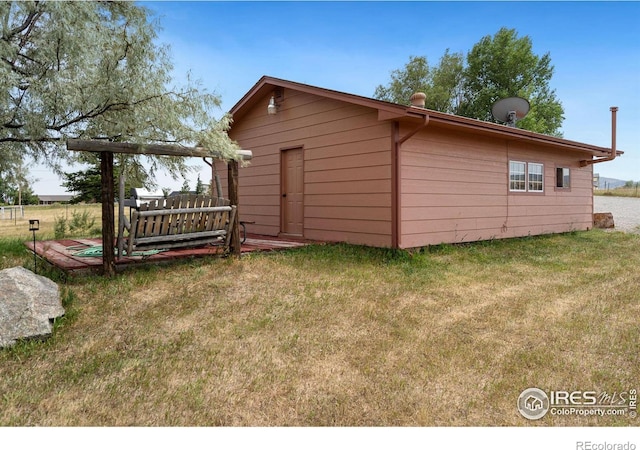 view of outdoor structure with a yard