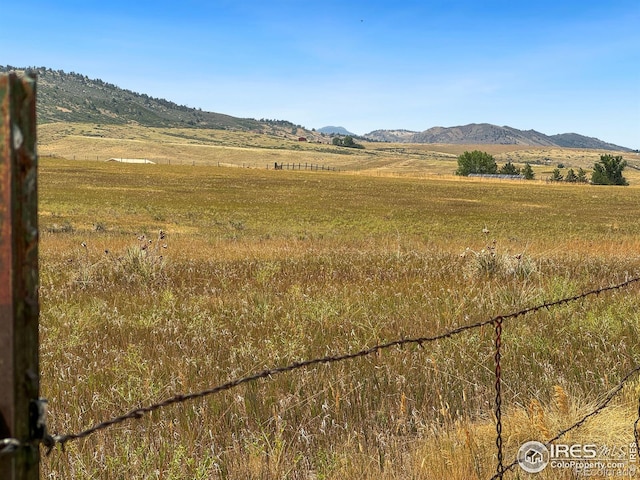 property view of mountains featuring a rural view