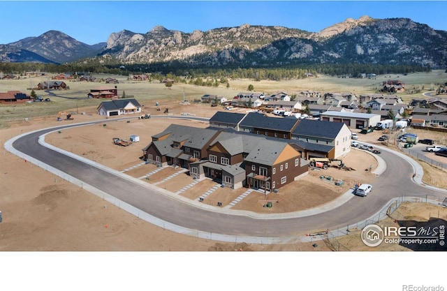 bird's eye view with a mountain view