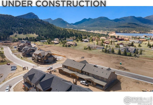 birds eye view of property featuring a mountain view