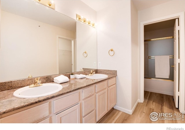 bathroom with vanity and hardwood / wood-style flooring