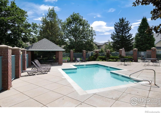 view of pool featuring a gazebo and a patio area