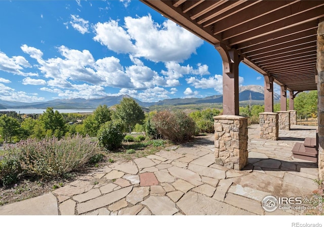 view of patio / terrace featuring a mountain view