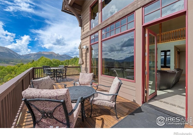 wooden terrace with a mountain view