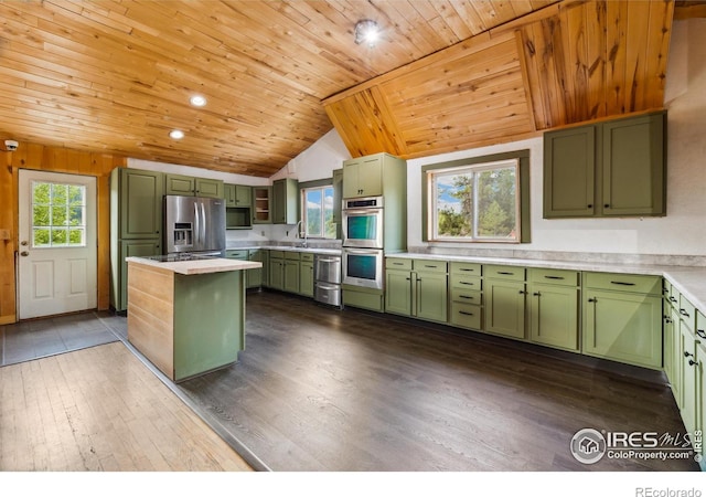 kitchen featuring appliances with stainless steel finishes, wooden ceiling, green cabinets, light countertops, and dark wood-style flooring