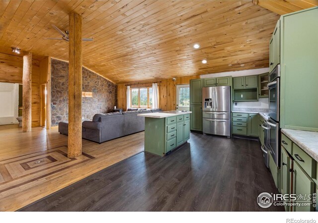 kitchen featuring appliances with stainless steel finishes, wood ceiling, green cabinetry, a center island, and dark wood-type flooring