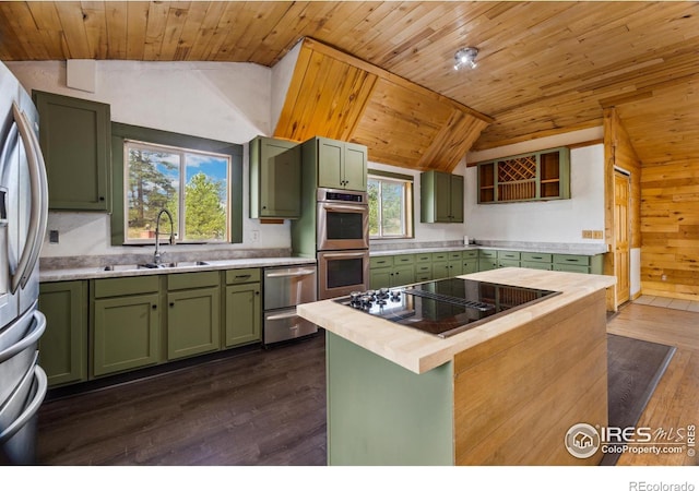 kitchen featuring vaulted ceiling, dark hardwood / wood-style flooring, and sink