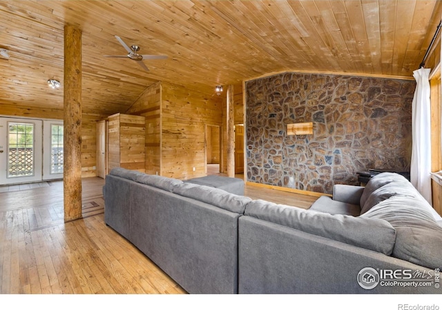 living room featuring light hardwood / wood-style floors, wooden ceiling, ceiling fan, and vaulted ceiling