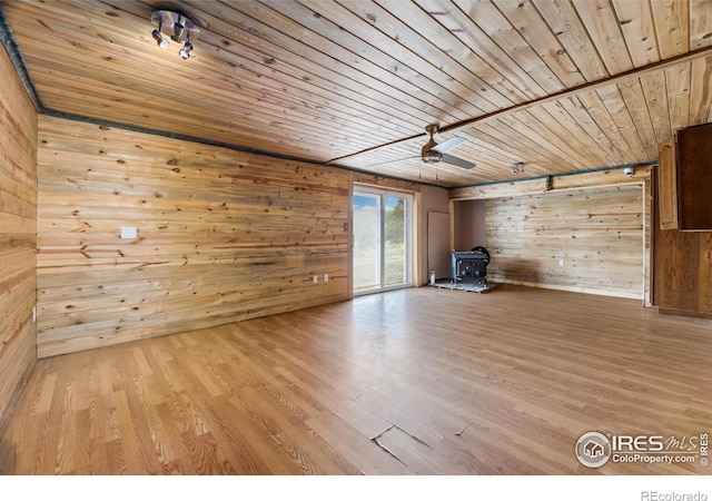 unfurnished living room featuring light wood-type flooring and wood ceiling