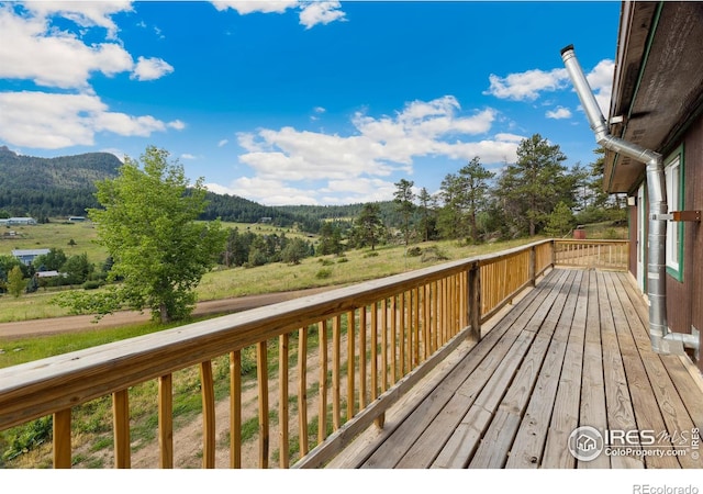 wooden terrace featuring a mountain view