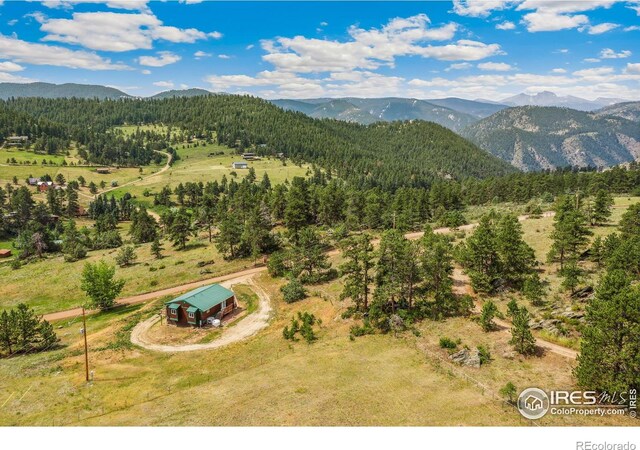 birds eye view of property featuring a mountain view and a rural view