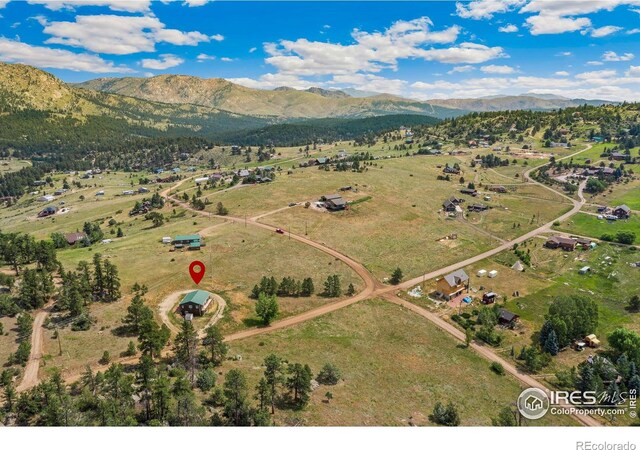 aerial view featuring a mountain view and a rural view