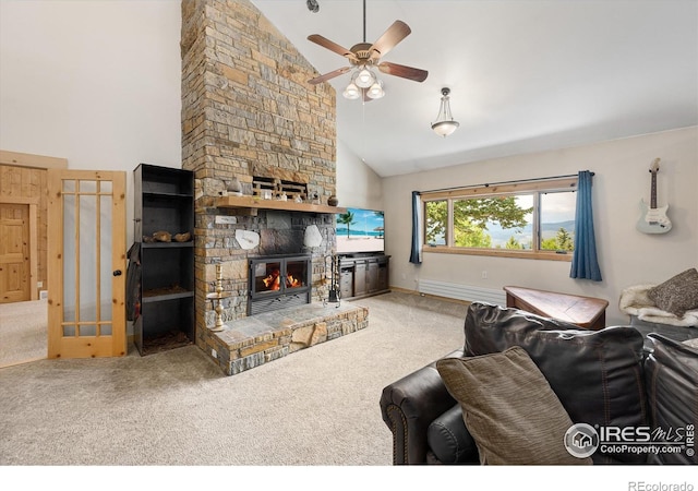 carpeted living room featuring ceiling fan, a fireplace, and high vaulted ceiling