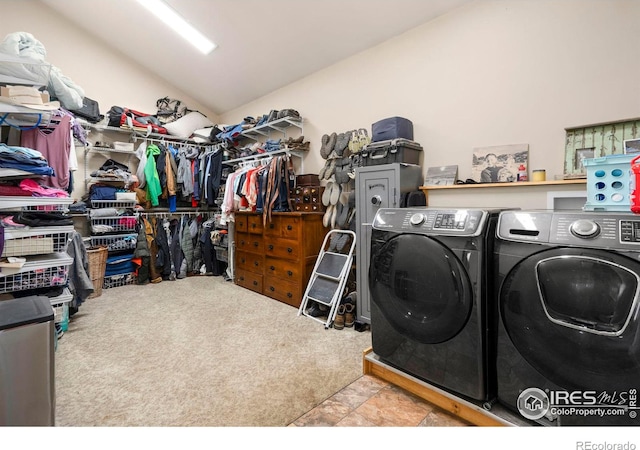 washroom with light colored carpet and washing machine and dryer